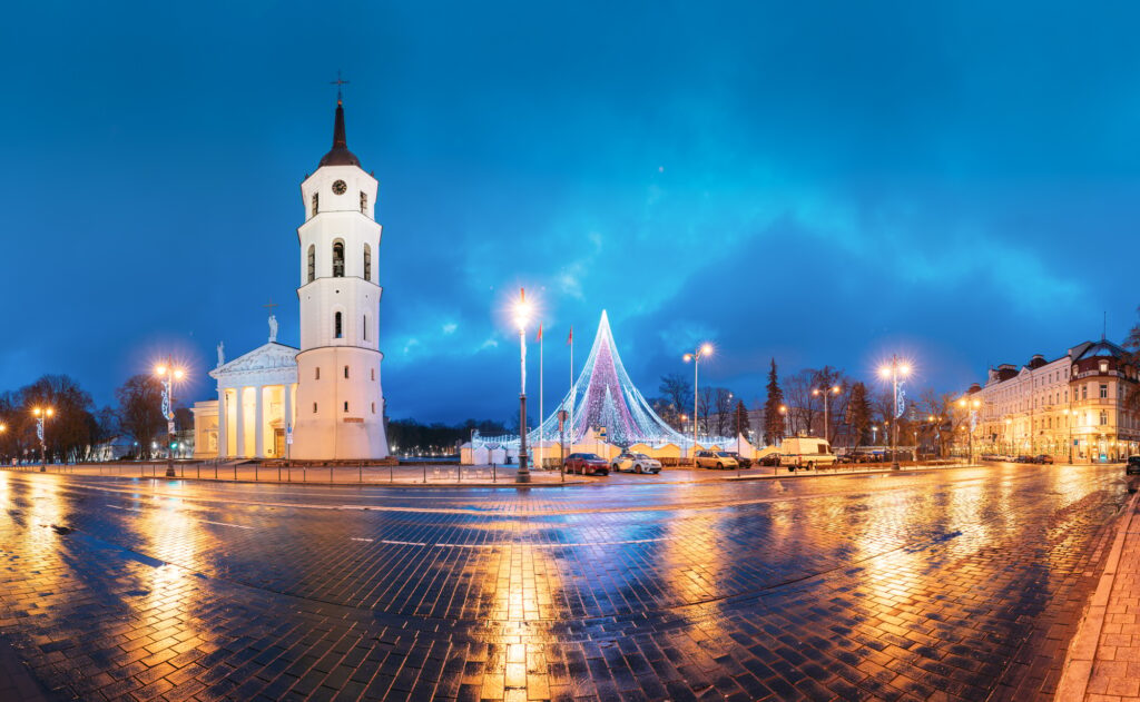 Vilnius, Lithuania. Christmas Tree On Background Bell Tower Belfry Of Vilnius Cathedral At Cathedral